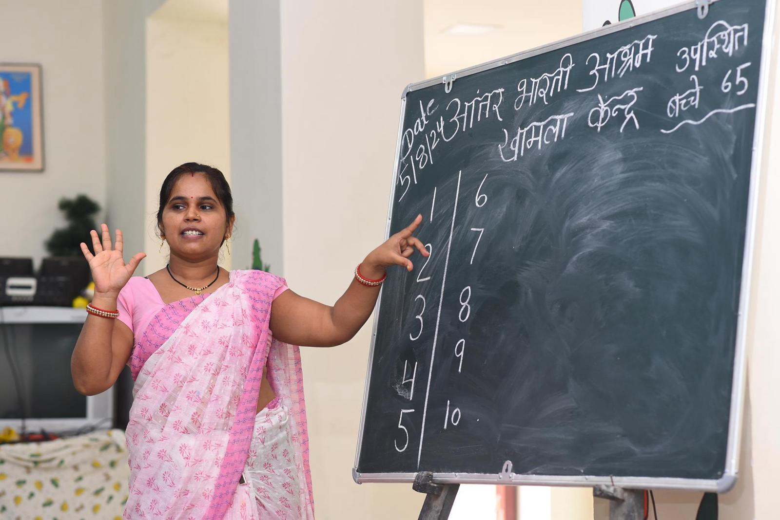 Teacher working with children at Antarbharti Ashram